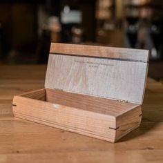 a wooden box sitting on top of a table