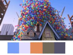 there is a house with many balloons on the roof