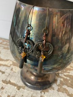 "Revived & Upcycled earrings featuring Vintage Antique Keys, AB Amber Swarovski crystals with Copper wire and Antiqued Gold ear hooks. 3\" long. One-of-a-Kind!!" Vintage Upcycling, Upcycled Earrings, Key Earrings, Ren Fair, Cute Mask, Raffia Hat, Velvet Hat, Antique Keys, Swarovski Beads