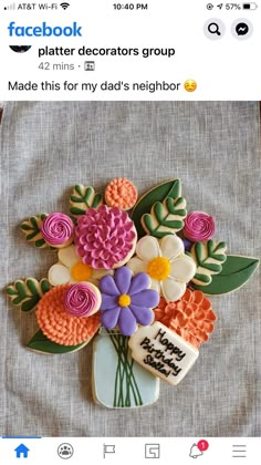 a decorated cookie with flowers on it