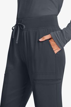 Break On Through to comfort and performance. Modern, sporty styles with athletic-inspired details, enhanced with a stretch dobby fabric. You’ll look cool – and feel cool too. • Contemporary fit • Low rise • Rib-knit covered elastic waistband with drawstring • Tapered leg • Total of 5 pockets • 2 front angeled patch pockets • 2 welt cargo pockets • 1 back right patch pocket • Step hem • Ankle vents • Approximate inseam for size M is 31 1 2 • Manufacturer style HS047 High performers need high-perf Med Couture Scrubs, Carhartt Scrubs, Healing Hands Scrubs, Maternity Scrubs, Cargo Scrub Pants, Koi Scrubs, Dickies Scrubs, Greys Anatomy Scrubs, Dobby Fabric