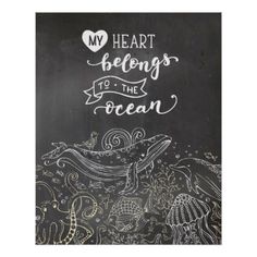 a chalkboard with the words, my heart belongs to the ocean