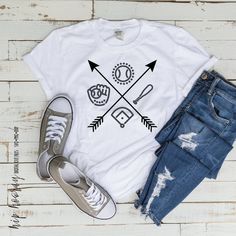 a t - shirt that says baseball and two crossed bats on it, next to ripped jeans