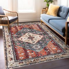 a living room filled with furniture and a large rug