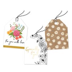 three tags with flowers on them hanging from twine string and one has a tag that says, for your wedding day especially for you