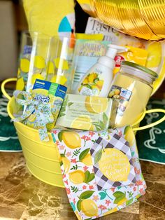 a yellow bucket filled with lemons and personal care items on top of a table