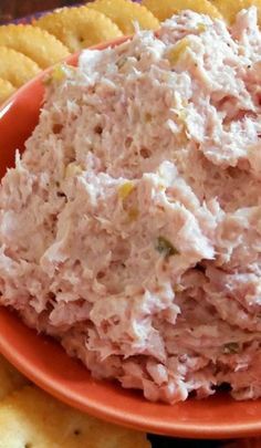 a plate with crackers and a bowl of tuna salad