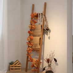 a room with a ladder, vases and other items on the floor next to it