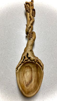 a wooden spoon that has some kind of decoration on it