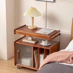 a small wooden table with a lamp on top