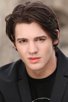 a close up of a person wearing a black shirt