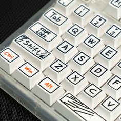 a close up of a keyboard with many different letters on it