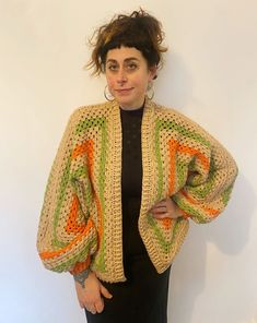 "Our lovely cosy knitwear is hand knitted by our team in the UK. Each one has its own unique colour and pattern and no two are the same.  Our knitwear is created from mixed wool using left over pieces from our other projects and follows our zero waste aesthetic. This includes wool and acrylic fibres. This beautiful sweater has cropped balloon style sleeves and squares of crochet. Oversized for that slouchy, cosy feel! We also make to order.. please contact us if you have a particular colour way in mind! MEASUREMENTS (approximate) Pit to pit unstretched laid flat 30\" Length shoulder to hem 27\" Length of sleeve from neckline 27\" CARE INSTRUCTIONS Handle as delicate cool wash Dry flat Do not tumble dry" Spring Cozy Sweater In Acrylic Yarn, Cozy Acrylic Yarn Sweater For Spring, Handmade Knit Cardigan In One Size, Handmade Knit One-size Cardigan, Handmade One-size Knit Cardigan, Multicolor Oversized Open Knit Sweater, Oversized Multicolor Open Knit Sweater, Knitted Long Sleeve Yarn Outerwear, Oversized Hand Knitted Beige Sweater