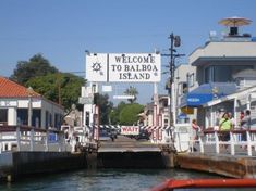 people are standing on the side of a boat dock with a sign that says welcome to baaboa island