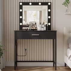 a dressing table with a mirror and lights on it