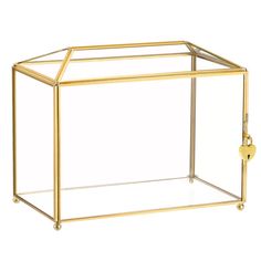 a glass and brass box on wheels with a handle in the shape of a cube