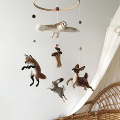 an animal mobile is hanging from the ceiling