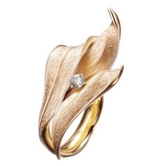 This contemporary Lily of The Valley Engagement Ring is made of 18 karat yellow gold and one round diamond. It has a sculptural shape. We use top colour natural diamonds, VS, 0,18 carats. We work with German gems companies that have been in business since the 19th century. The ring can be personalised with a name or a saying. Please allow us time to customize the ring. The ring can be ordered as usual fashion ring. The size and the colour of the gold can be changed. Rose Diamond Ring, Art Nouveau Ring, Neck Pieces Jewelry, Ring Jewellery Design, Contemporary Jewelry Design, Contemporary Ring, Leaf Jewelry, Couture Jewelry, Harpers Bazaar