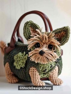 a crocheted bag with a small dog on it's front and side