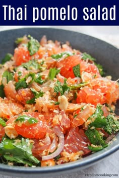 there is a salad in the bowl with tomatoes and broccoli on it that says thai pomelo salad