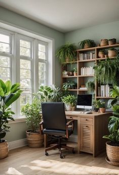 a home office with lots of plants in the corner