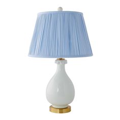 a white lamp with a blue shade on it