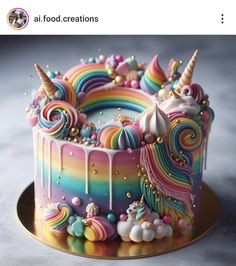 there is a cake decorated with rainbows and unicorns on the top of it