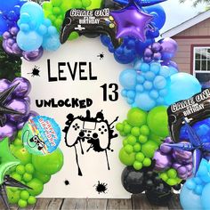 a bunch of balloons that are in the shape of a video game controller and numbers