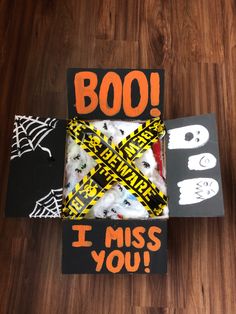 a box that has been decorated to look like a halloween scene with the words boo i miss you on it