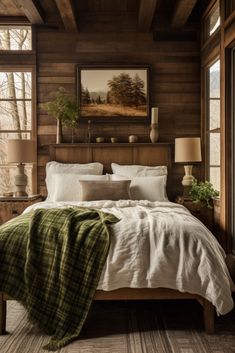 a bedroom with wood paneling and white bedding