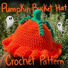 a crocheted pumpkin hat with ghost faces on it and the words pumpkin bucket hat