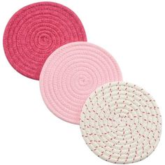 three pink and white rugs on a white background