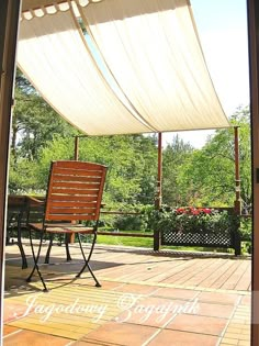 an open patio door with a chair and table