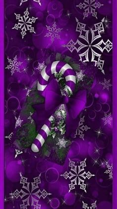 a purple christmas card with candy canes and snowflakes