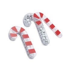 two candy canes sitting next to each other