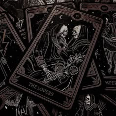 the lovers tarot cards are shown in this black and white photo, with skeletons on them