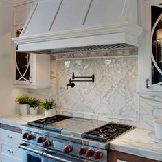 a stove top oven sitting inside of a kitchen