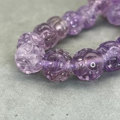 Style: Natural Purple Amethyst bead, hand carved, with symbol of longevity and dragon Material: Amethyst, natural color, purple, very translucent Method: hand carved and polished Type: Bead, Charm, mala Size: 14mm Longevity Symbol, Handmade Mystical Purple Crystals, Spiritual Purple Polished Beads, Elegant Purple Faceted Beads Gemstones, Purple Faceted Beads Amethyst Gemstones, Purple Faceted Amethyst Beads, Year Of The Dragon, Purple Stones, Amethyst Beads