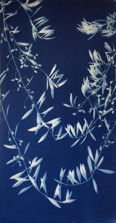 a blue and white painting with leaves on it