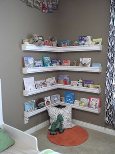 a child's room with bookshelves and stuffed animals on the shelves in it