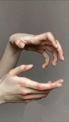 two hands reaching towards each other with one hand extended out to touch the other's arm