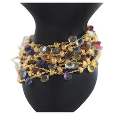 MARCO BICEGO Paradise Collection Multicolor Gemstones 10 Strand Bracelet with mixed semi-precious colored stones 18k Yellow Gold Length: 7.25" in length Weight: approx. 53.8 grams Width: approx. 42mm Stamped Hallmarks: Marco Bicego 750 In great looking condition wear consistent with time and some use See images please No original box or papers Luxury Multicolor Briolette Jewelry, Luxury Multicolor Gemstones, Luxury Multicolor Natural Gemstones, Gold Briolette Bracelets With Natural Stones, Luxury Multicolor Multi-stone Gemstones, Luxury Multicolor Gemstones With Accents, Luxury Multicolor Gemstone Bracelets, Multicolor Stone Bracelets In Fine Jewelry Style, Multicolor Stone Bracelets Fine Jewelry