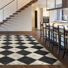 a kitchen with a checkered floor and stairs