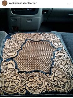 the inside of a car with an intricate design on it's seat cushion and dashboard