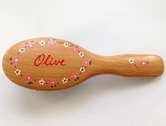 KENT PERSONALISED WOODEN HAIRBRUSH - Garland design NATURAL BRISTLE This top quality hairbrush is made by the renowned manufacturers Kent who have been making hairbrushes since 1777 and are by appointment to HM the Queen. The personalised name will be added to complement the special hand painted design. The wooden brush is made of natural bristle on rubber cushion.  Ideal for straightening and grooming short to shoulder length hair.  Natural bristle is perfect for stimulating the hairs natural o Shoulder Length Hair Natural, Wooden Hairbrush, Wooden Hair Brush, Garland Design, Wooden Brush, Natural Hair Oils, Styling Brush, Gifts For Children, Shoulder Length Hair