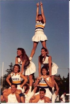 a group of cheerleaders posing for a photo