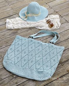 two crocheted bags and a hat on a wooden floor