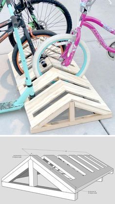 two bikes parked next to each other on top of wooden pallets and the bottom one is made out of plywood planks