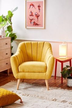 a living room with two chairs and a rug