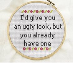 a cross stitch pattern with the words i'd give you an ugly look, but you already have one